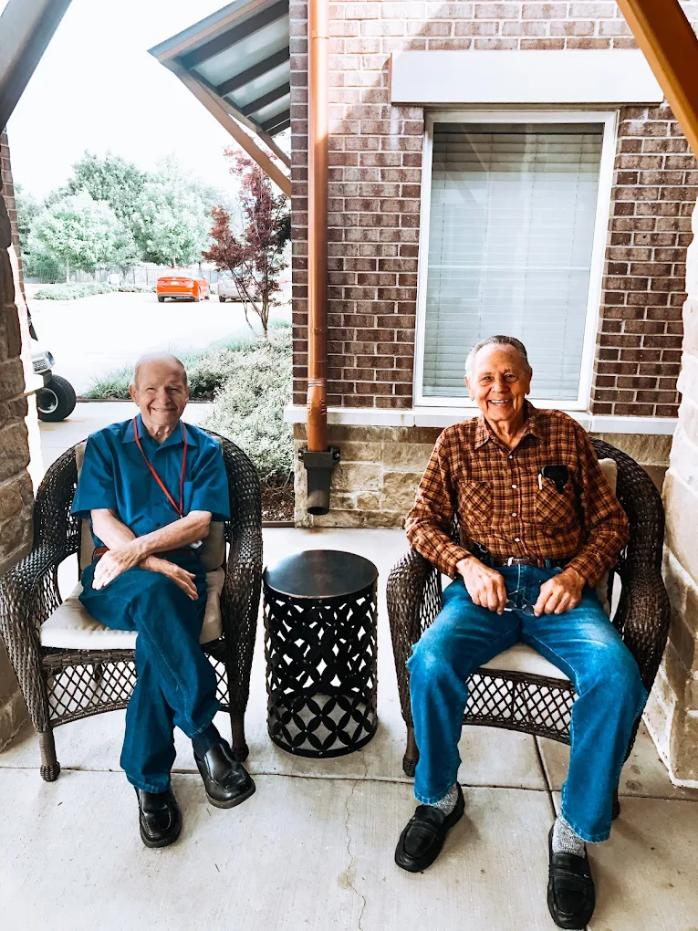 Residents enjoying time together in a bright community lounge